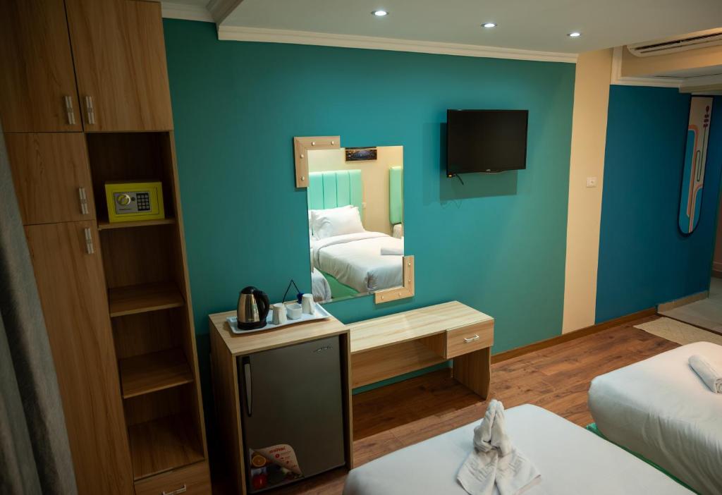 Postel nebo postele na pokoji v ubytování Soft Hotel
