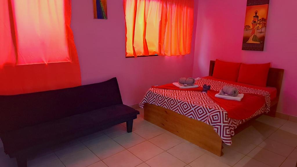 Postel nebo postele na pokoji v ubytování Caribbean Blue Morpho Casitas