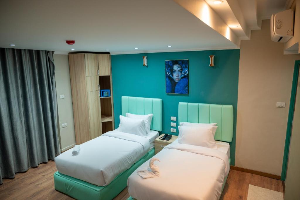 Postel nebo postele na pokoji v ubytování Soft Hotel