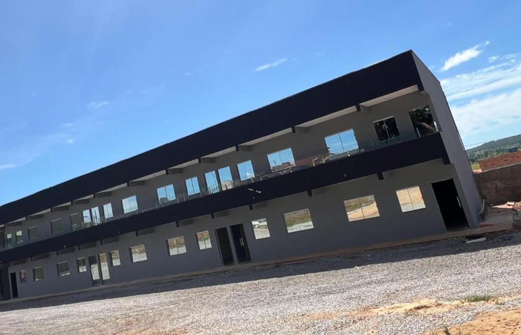a large building with windows on the side of it at Residencial Mangueiral in Paracatu