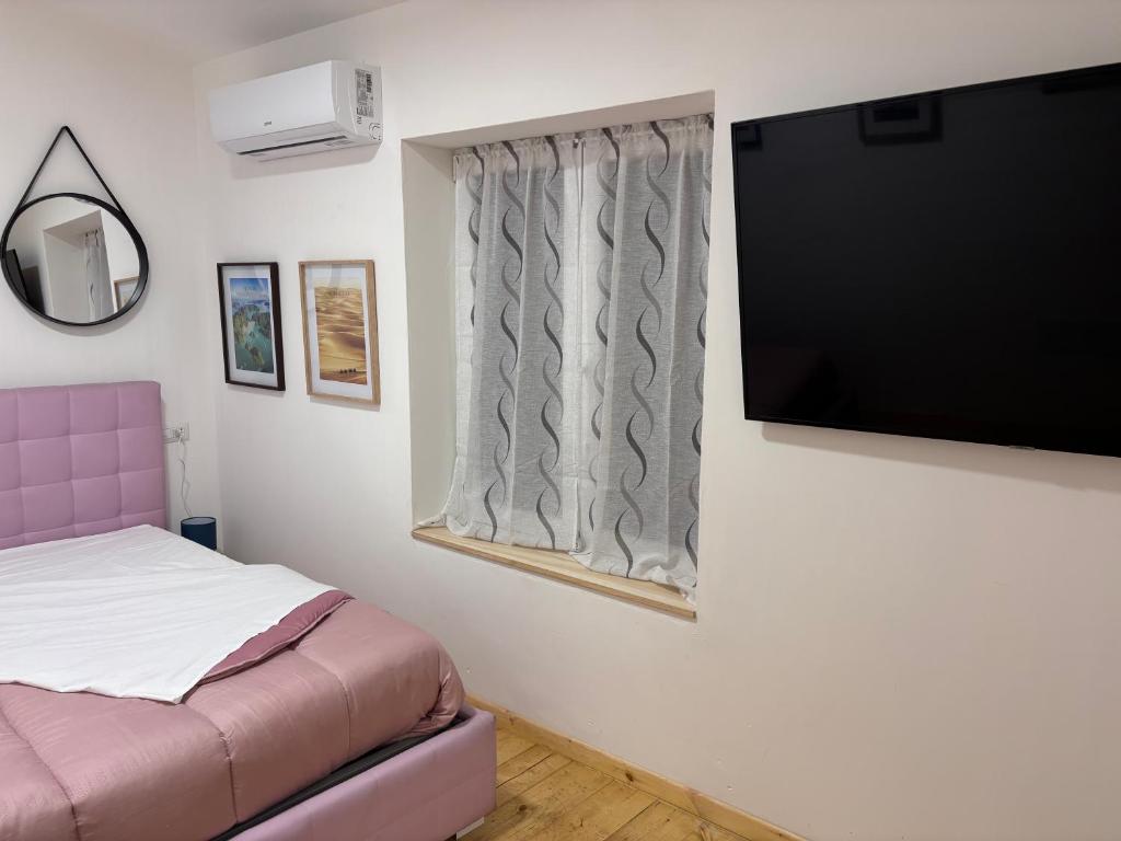 Postel nebo postele na pokoji v ubytování Violet appartament