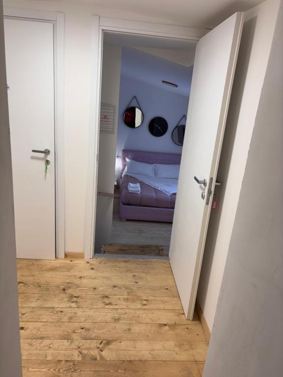 Postel nebo postele na pokoji v ubytování Violet appartament