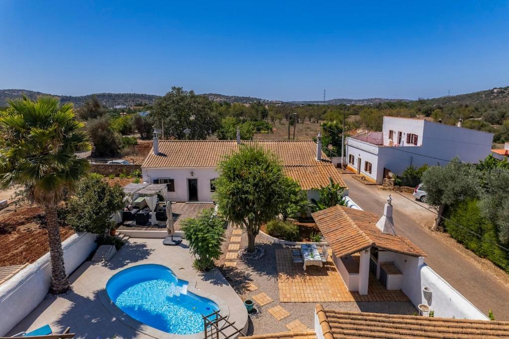 an aerial view of a house with a swimming pool at Villa Antiga in Alcaria