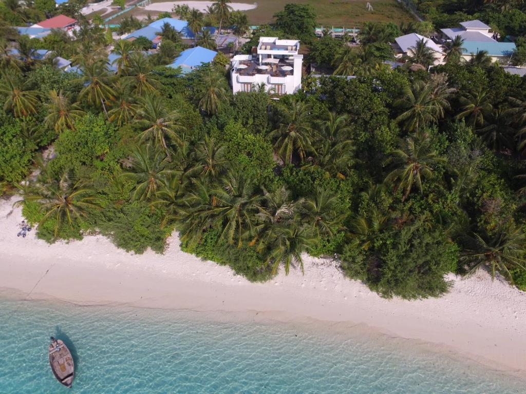 an aerial view of a beach with a resort at Boutique Beach All Inclusive Diving Hotel in Dhigurah