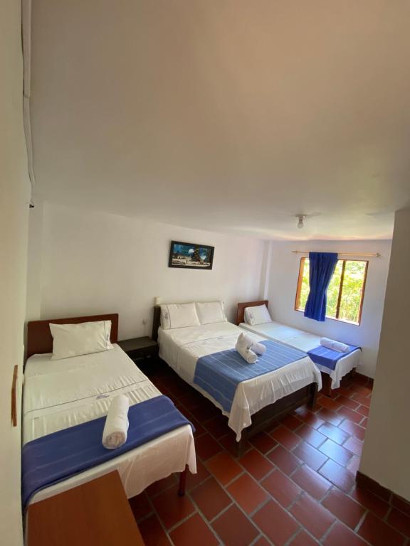 Postel nebo postele na pokoji v ubytování Hotel Davilejas