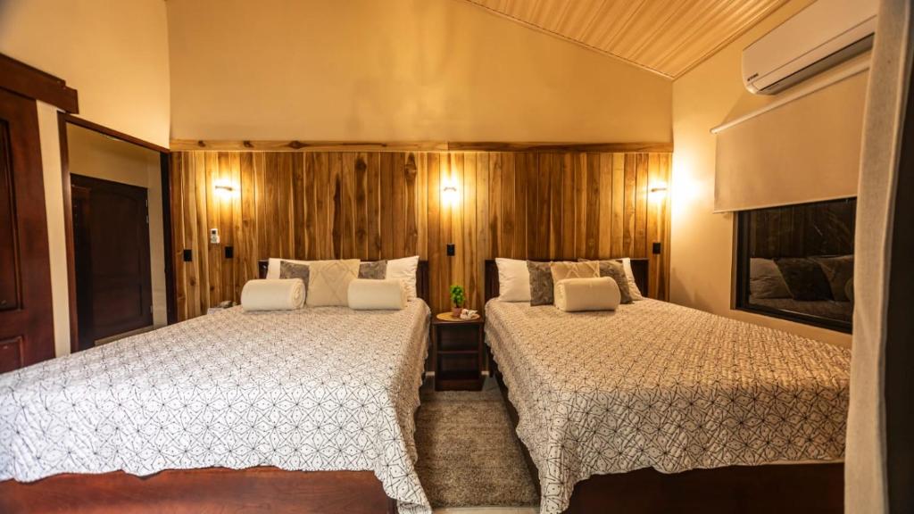 Postel nebo postele na pokoji v ubytování Valle Arenal