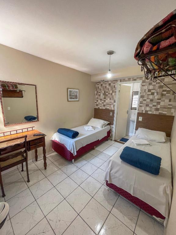 Postel nebo postele na pokoji v ubytování Pousada dos Franceses