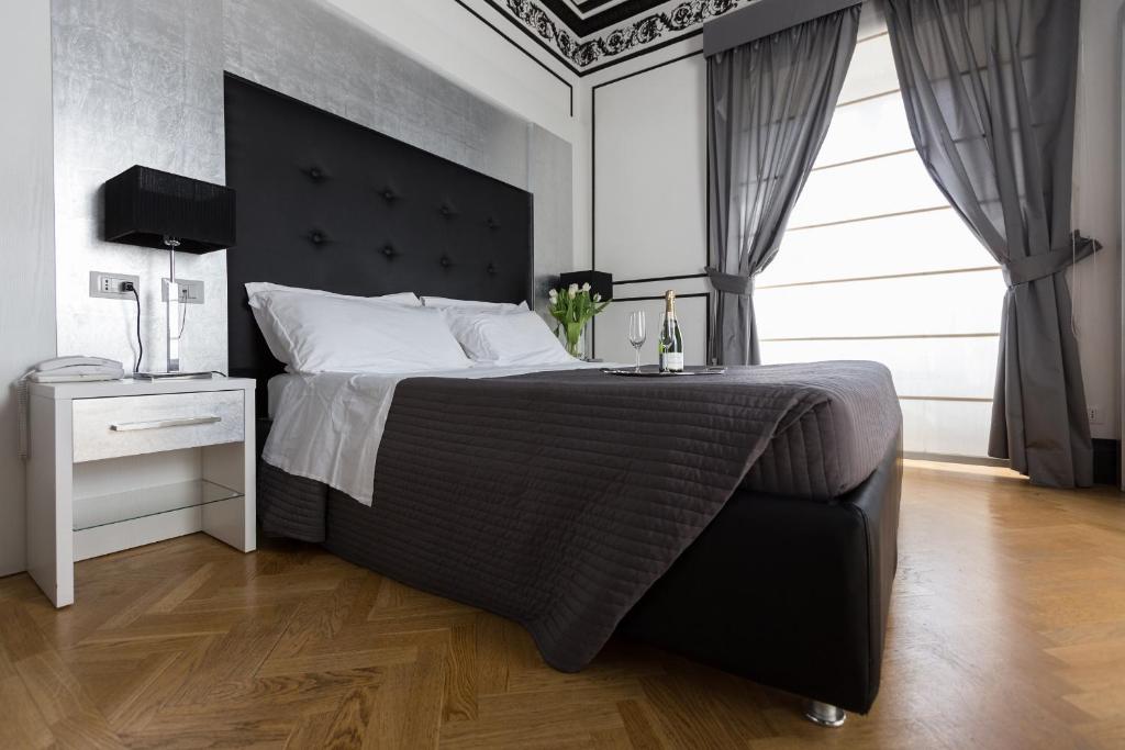 Postel nebo postele na pokoji v ubytování Residenza Scipioni Luxury B&B