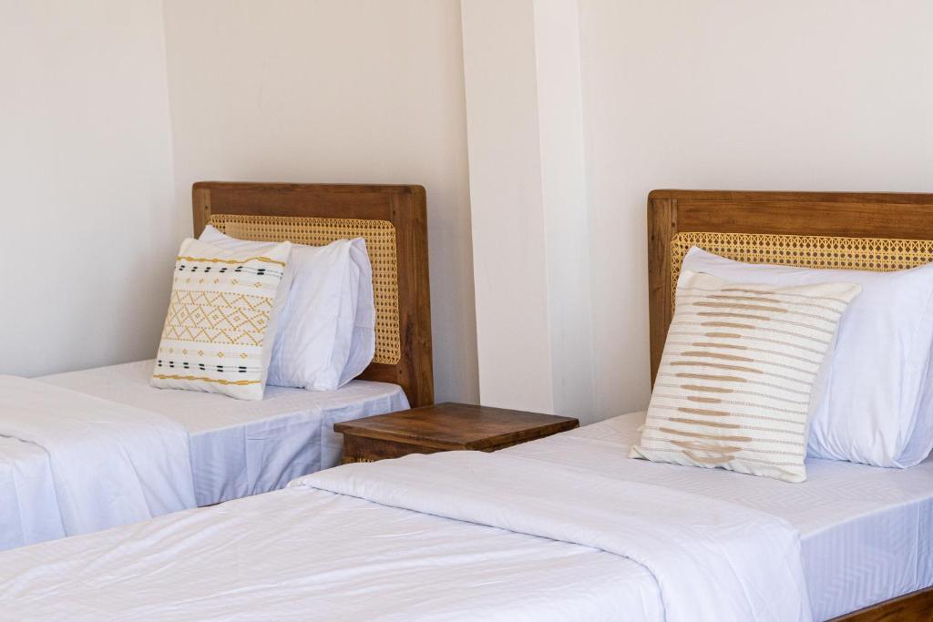 Postel nebo postele na pokoji v ubytování Sansun Guesthouse