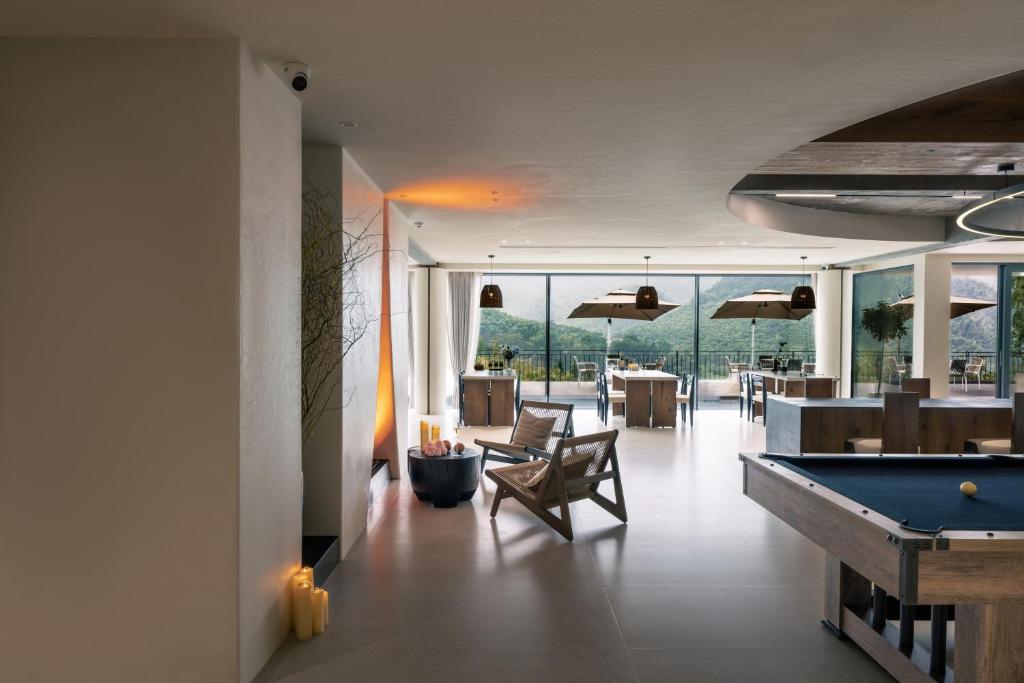 a billiard room with a pool table and a view at Wild Persimmon Manor Cove Mist Healing Hot Spring in Anji