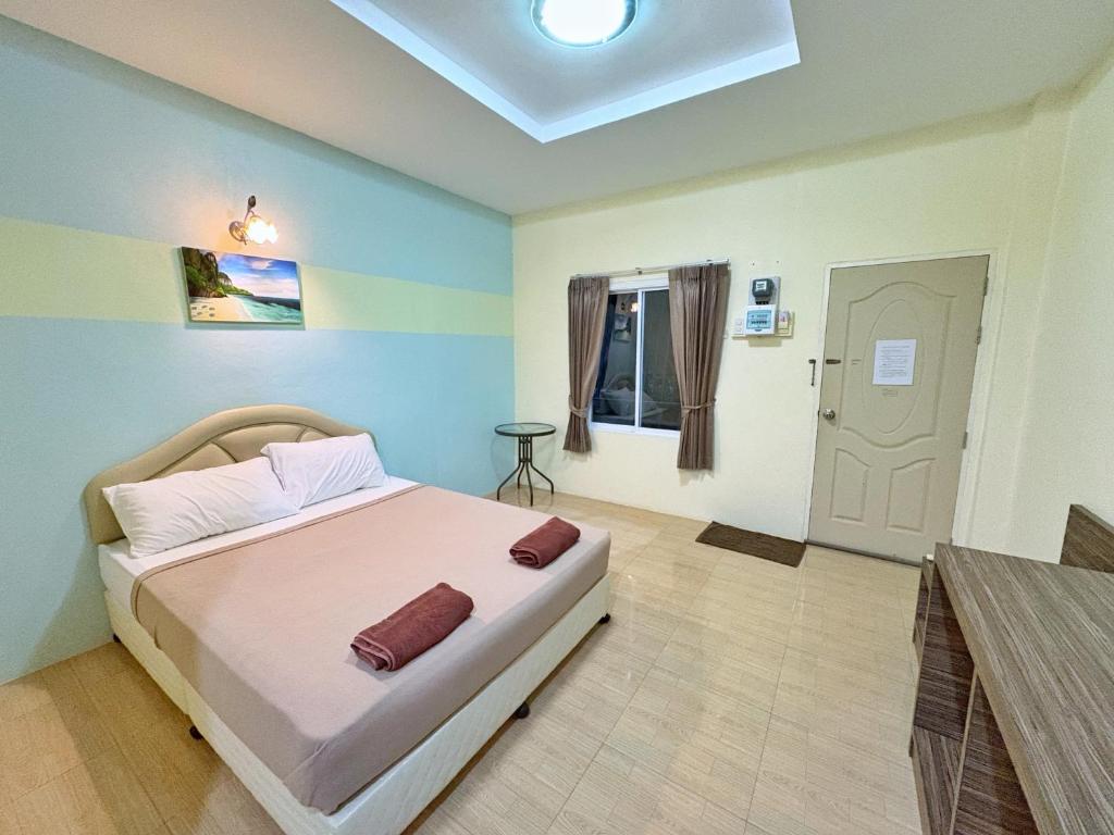 Postel nebo postele na pokoji v ubytování Krabi Ava Hill
