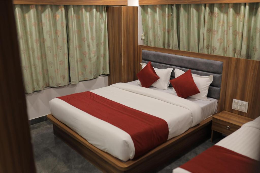 Postel nebo postele na pokoji v ubytování Hotel Maruti R