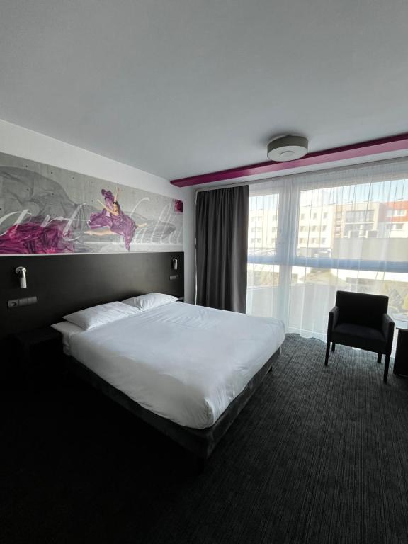 Postel nebo postele na pokoji v ubytování B&B HOTEL Bytom