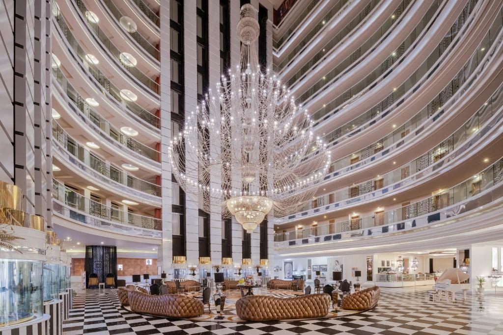 a large chandelier in the lobby of a hotel at Delphin Imperial Lara in Lara