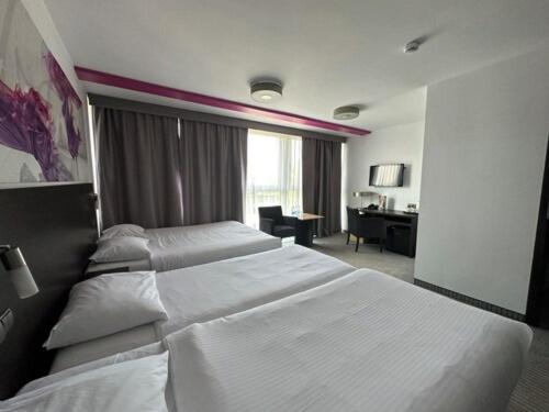 Postel nebo postele na pokoji v ubytování B&B HOTEL Bytom