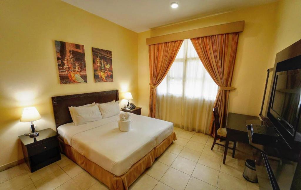 Postel nebo postele na pokoji v ubytování Asfar Resorts Al Ain