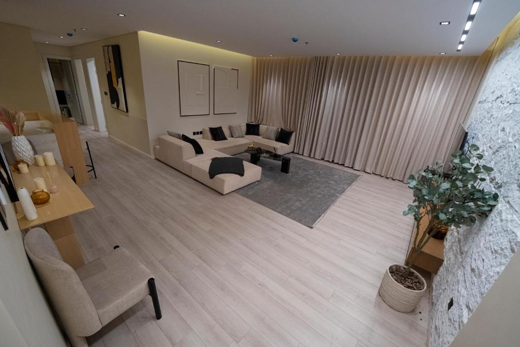 a living room with a couch and a table at Latifa Housing in Riyadh
