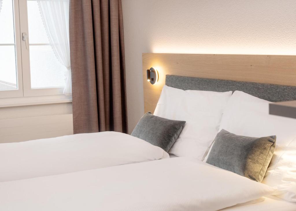 Postel nebo postele na pokoji v ubytování Hotel Restaurant Kreuz