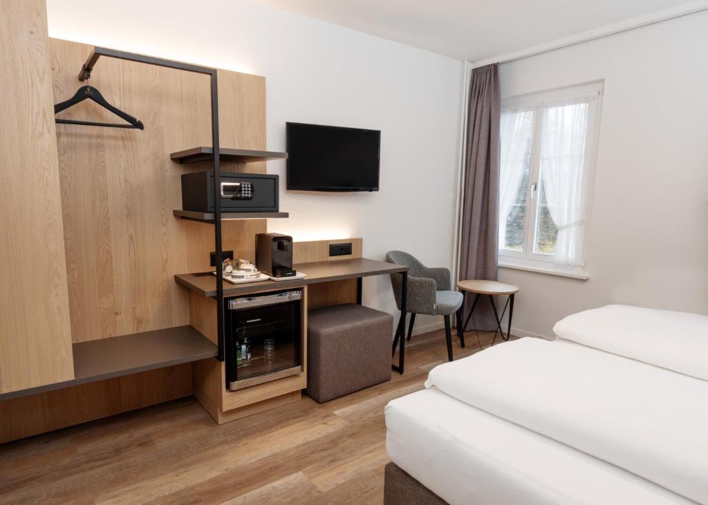 TV a/nebo společenská místnost v ubytování Hotel Restaurant Kreuz
