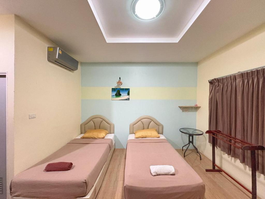 Postel nebo postele na pokoji v ubytování Krabi Ava Hill
