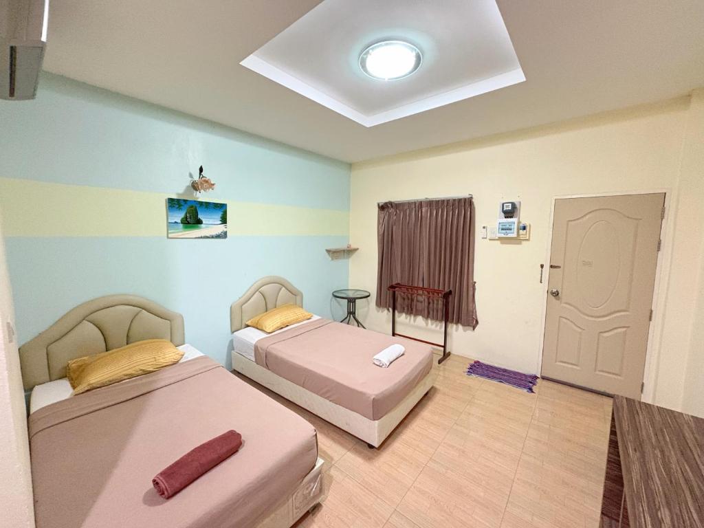 Postel nebo postele na pokoji v ubytování Krabi Ava Hill