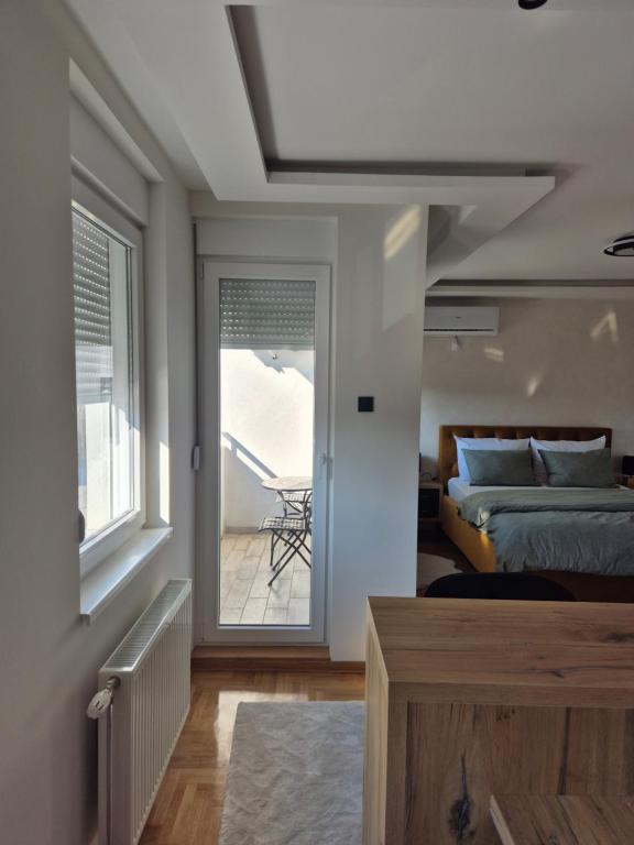 Postel nebo postele na pokoji v ubytování Apartman Milica
