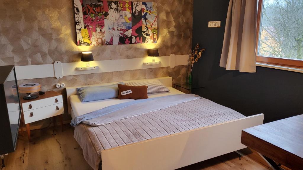 Ένα ή περισσότερα κρεβάτια σε δωμάτιο στο Landliebe Ferienwohnung