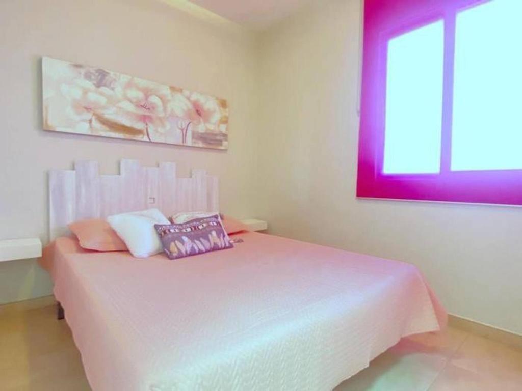 A bed or beds in a room at OLIMPE 2 8