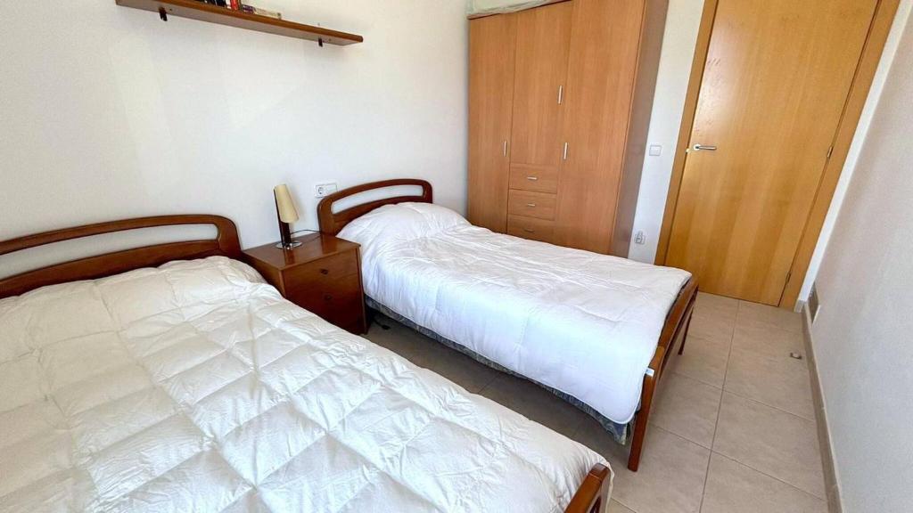 A bed or beds in a room at Puigmal