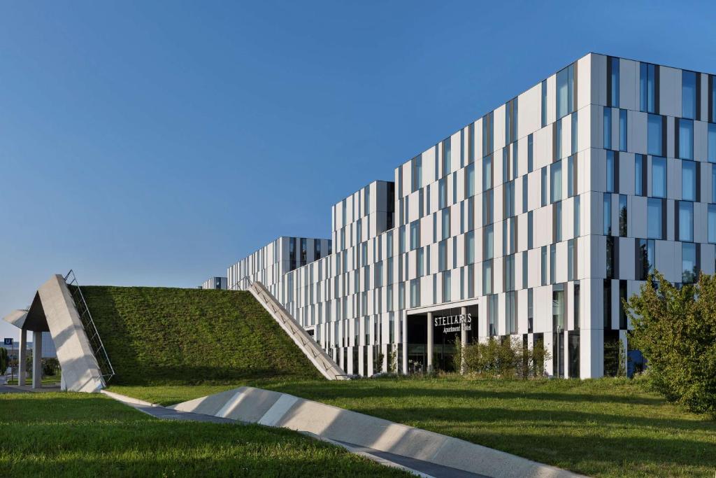 a building with a skate ramp in front of it at Stellaris Apartment Hotel in Garching bei München