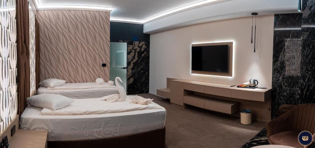 Postel nebo postele na pokoji v ubytování Wonderland Cluj Resort