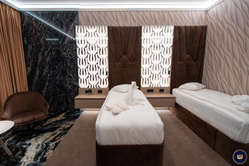 Postel nebo postele na pokoji v ubytování Wonderland Cluj Resort