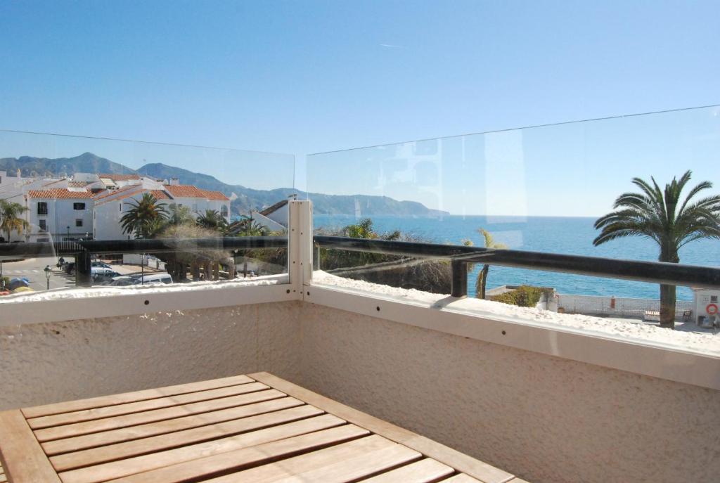a balcony with a view of the ocean at Carabeo 24 Apartments Casasol in Nerja