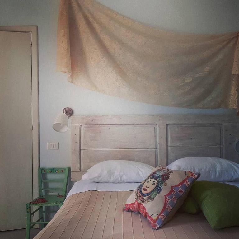 Postel nebo postele na pokoji v ubytování Sottovento Marzamemi Rooms&Relax