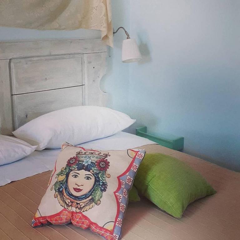 Postel nebo postele na pokoji v ubytování Sottovento Marzamemi Rooms&Relax