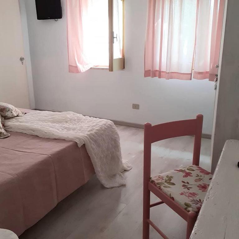 Postel nebo postele na pokoji v ubytování Sottovento Marzamemi Rooms&Relax
