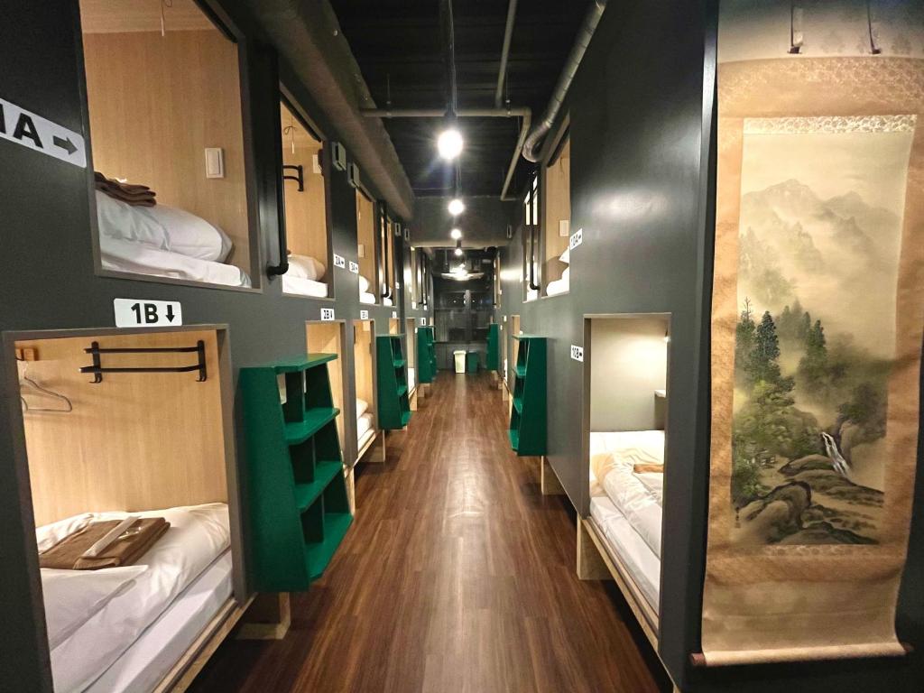 Postel nebo postele na pokoji v ubytování Yoroi Asakusa Hotel