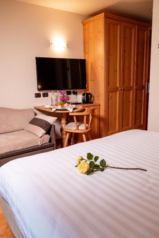 Postel nebo postele na pokoji v ubytování Romantic Charming Hotel Rancolin