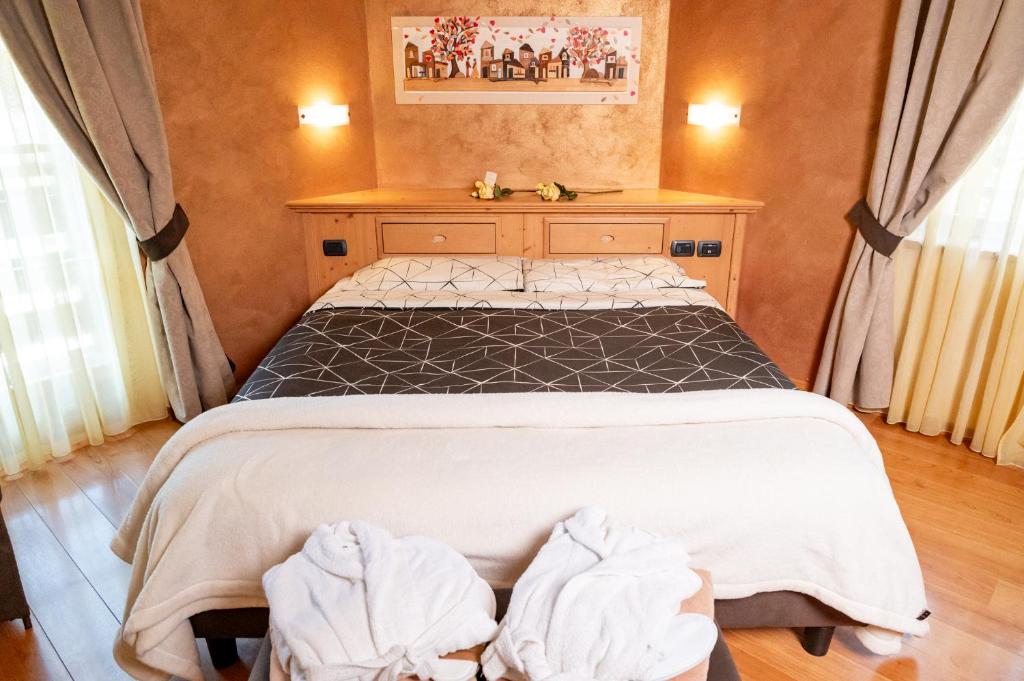 Postel nebo postele na pokoji v ubytování Romantic Charming Hotel Rancolin