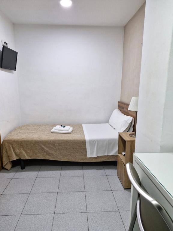 Postel nebo postele na pokoji v ubytování Hostal Elkano