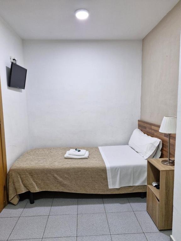 Postel nebo postele na pokoji v ubytování Hostal Elkano