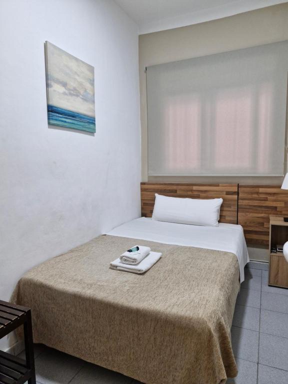 Postel nebo postele na pokoji v ubytování Hostal Elkano