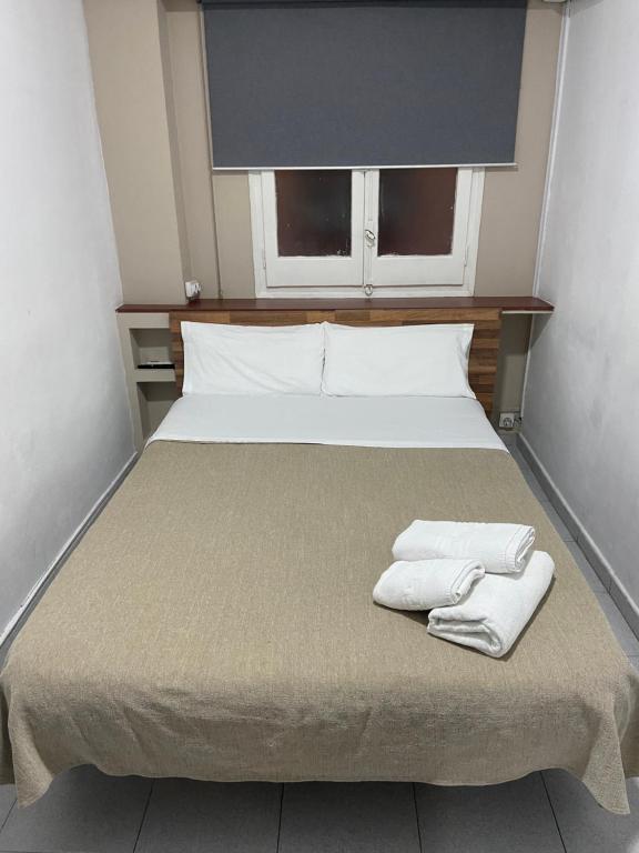 Postel nebo postele na pokoji v ubytování Hostal Elkano
