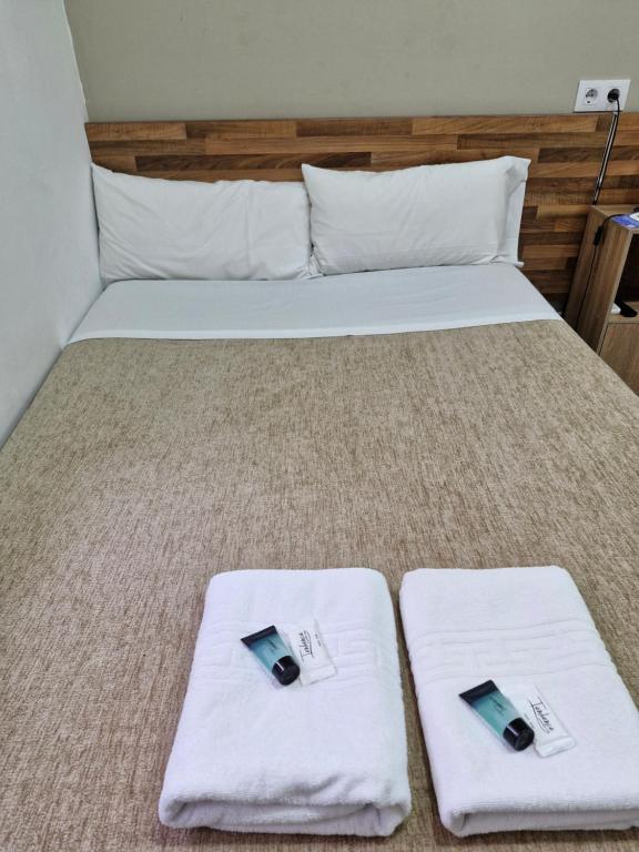 Postel nebo postele na pokoji v ubytování Hostal Elkano