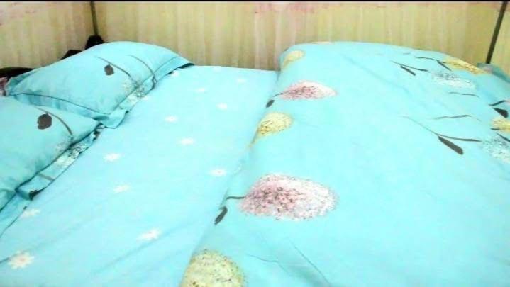 Postel nebo postele na pokoji v ubytování Greencity Hotel
