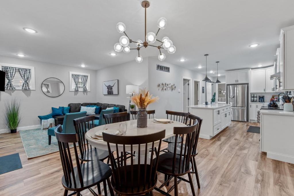 a kitchen and living room with a table and chairs at 4456 Blue Door Bungalow in Southhampton