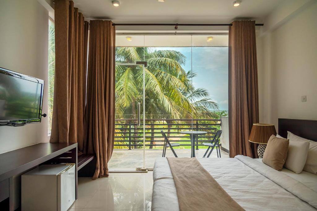 TV a/nebo společenská místnost v ubytování Beverly Beach Negombo
