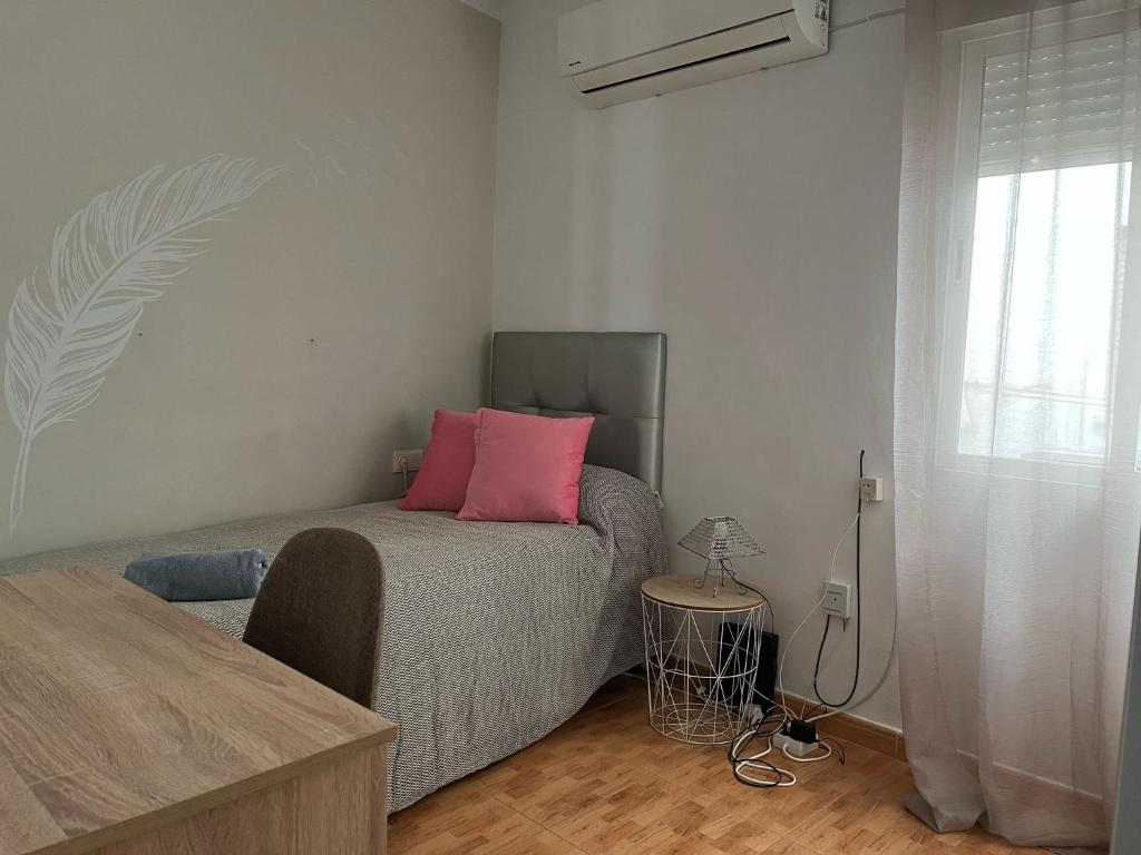 A bed or beds in a room at Vivienda con fines turísticos ALMA