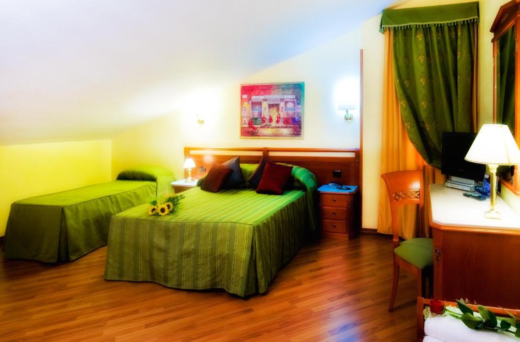 Postel nebo postele na pokoji v ubytování Hotel Bright