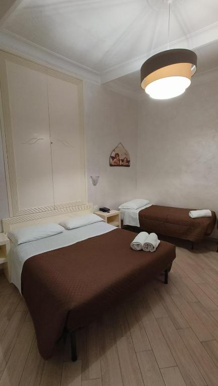 Postel nebo postele na pokoji v ubytování Hotel PRINCIPE AMEDEO